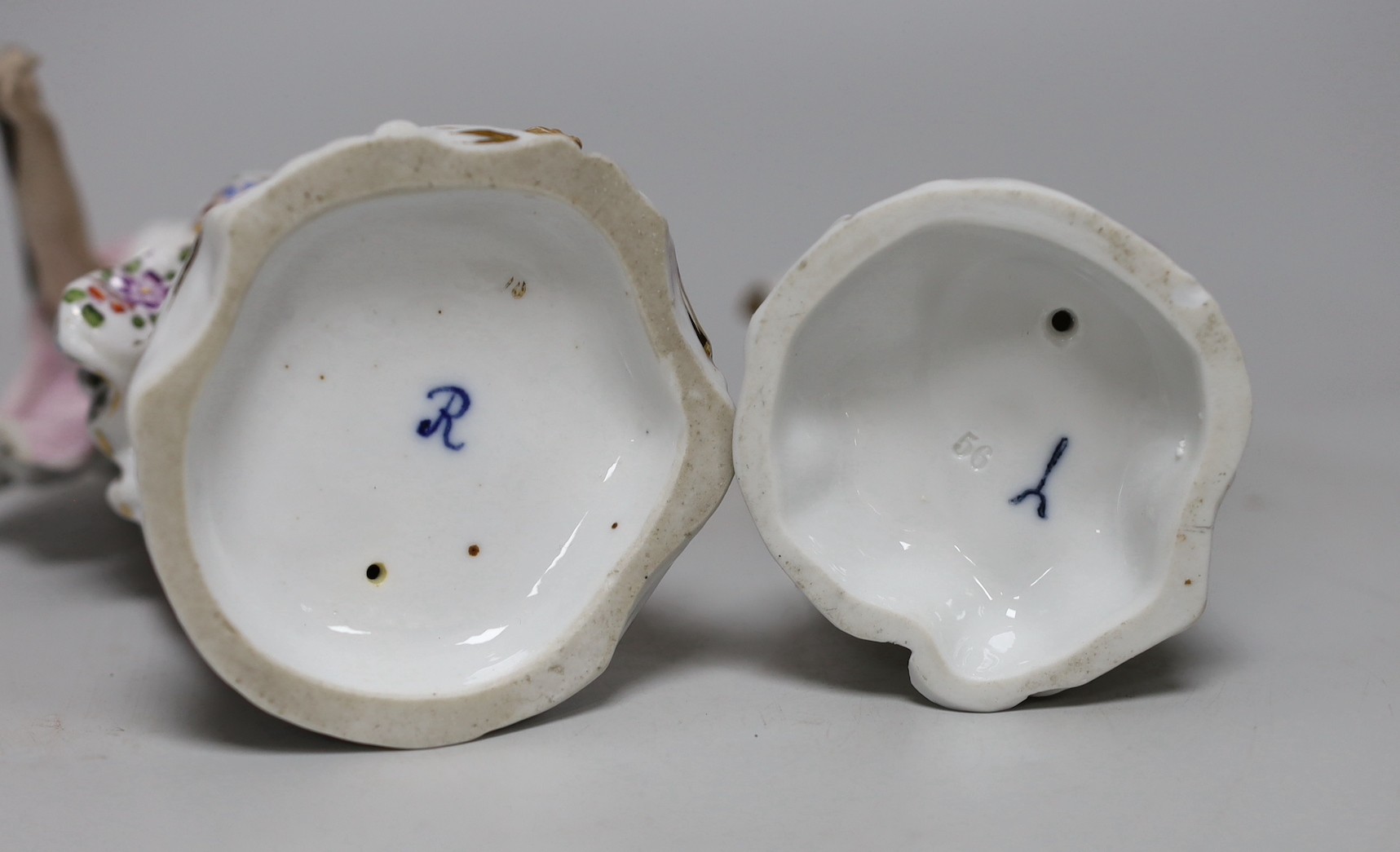 Two German porcelain figures, tallest 31cms high, a Fraureuth model of a dachshund and a Paris scent bottle